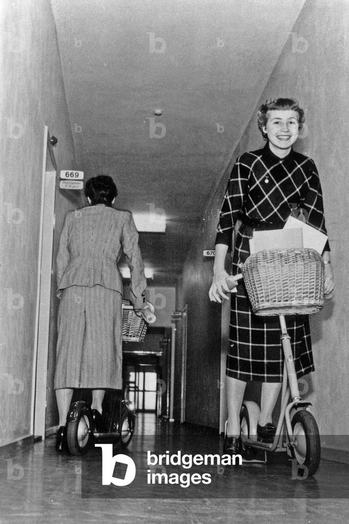 Scooters used to get around in a big building in Copenhague October 30, 1953