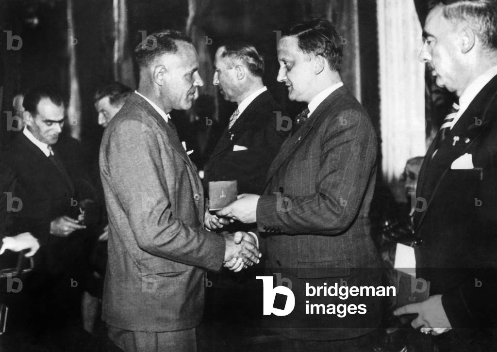 Jean Bichelonne (r, 1904-1944) giving medals to employees of SNCF (French railways) ww2