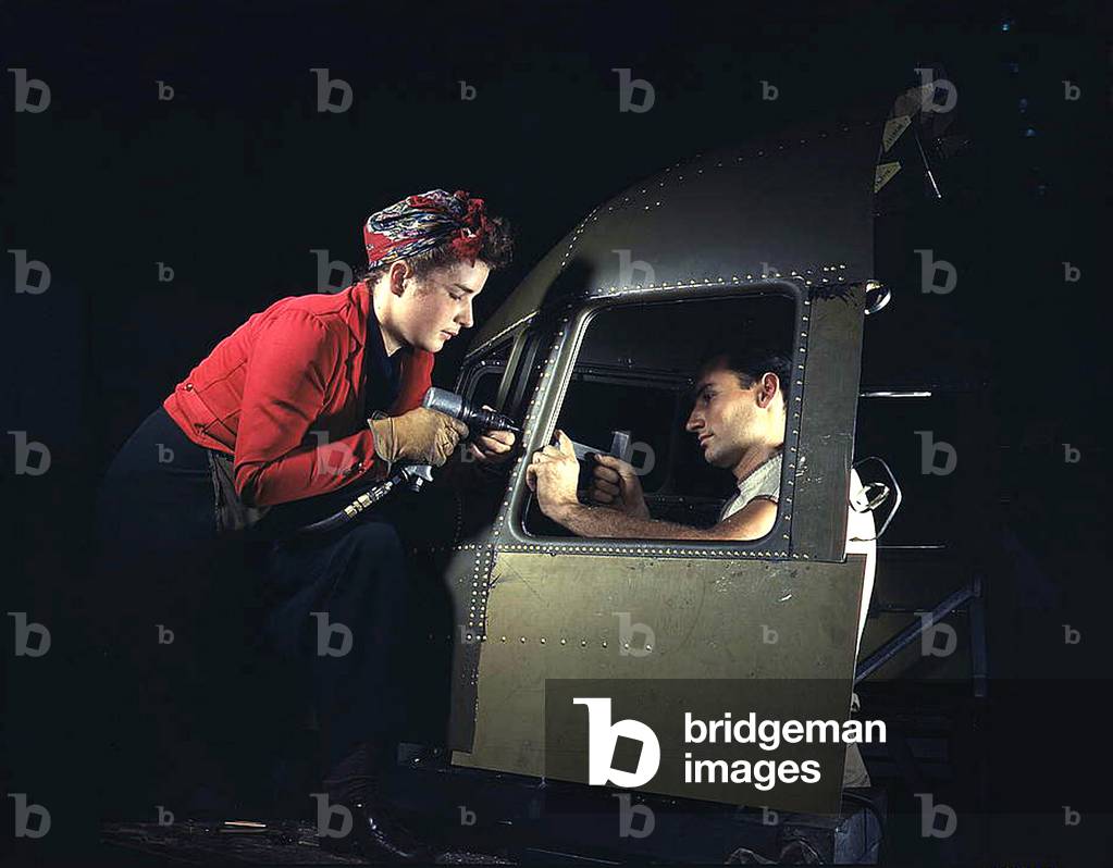 Men and women make efficient operating teams on riveting and other jobs at the Douglas Aircraft plant, Long Beach, Calif. Most important of the many types of aircraft made at this plant are the B-17F (