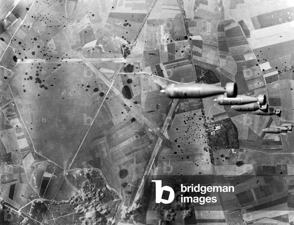 View of bombs dropping from American B17 flying fortress : Allied bombings on German occupied airport in Abbeville August 19, 1942