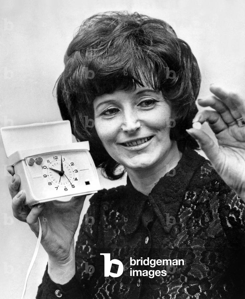 Pill and alarm clock, alarm clock which rings until a button is pushed and the pill comes out of the top of the clock, fevrier 1971