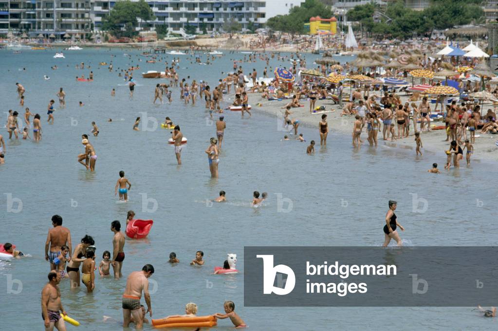 People at the beach of Palma Nova in Mallorca in Baleares (Spain) in July 1978