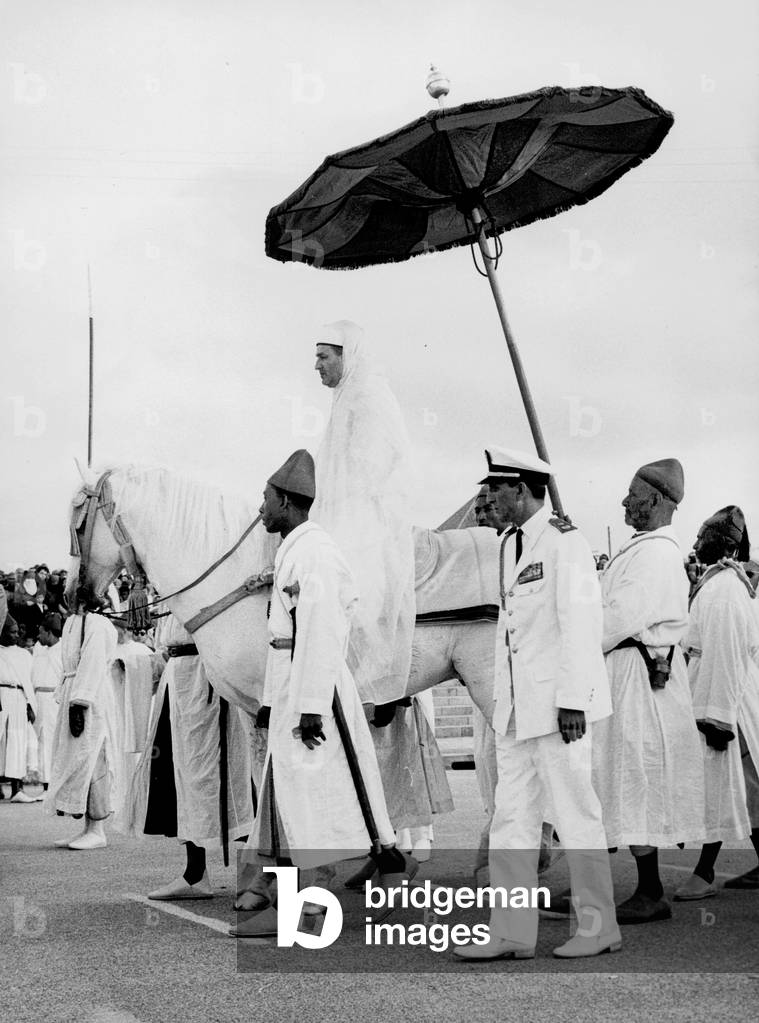 king Mohammed V of Morocco in Rabat June 1960 during Aid-El-Kebir ceremony with his son future Hassan II and General Oufkir before the BenBarka affair (1964)