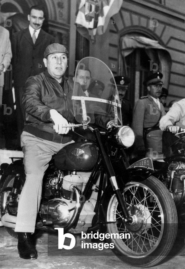 As he was entitled First Sportsman of Argentina argentine President Peron goes to the house of his government on motorbike December 4, 1954