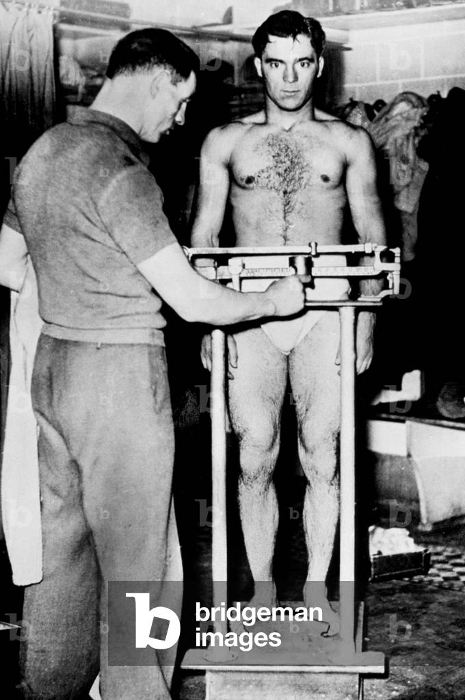 Marcel Cerdan (1916-1949) French boxer here at the weighing June 18, 1939, in Marseille befre match against CletoLocatelli