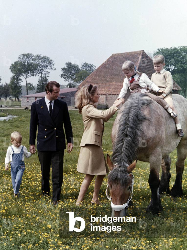 Prince Albert of Belgium (future King  Albert II) and Princess Paola with their 3 children : Astrid and Philippe (horse) and Laurent (with father) in Lisseweghe near Bruges 1967