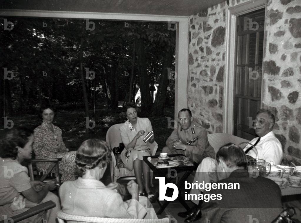 Franklin Roosevelt and Crown Princess Martha of Norway, King  George II of Greece, FDR, and others on the porch of Top Cottage, June 27, 1942