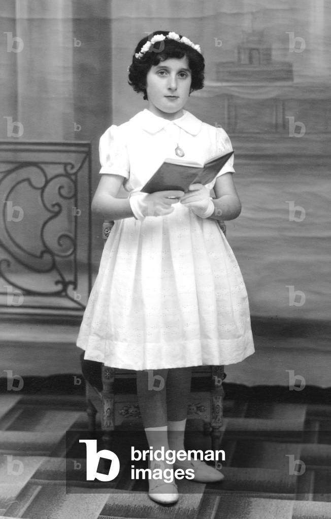 Girl making her first communion, c. 1955 (b/w photo)