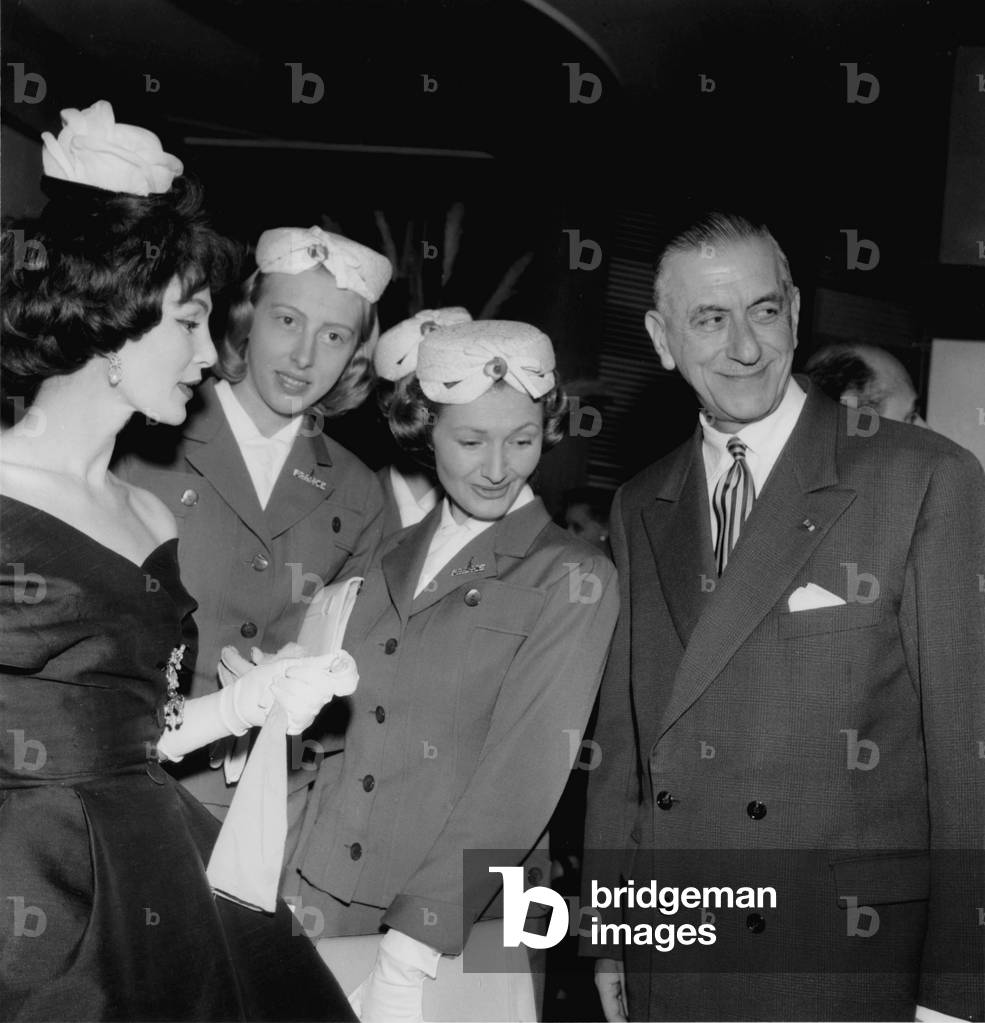 Lucky with her hostess of the French pavilion in Brussels (during wolrd fair) at a reception in Brussels. On the right, Pierre de Gaulle, CharlesdeGaulle's brother, April 1st, 1958