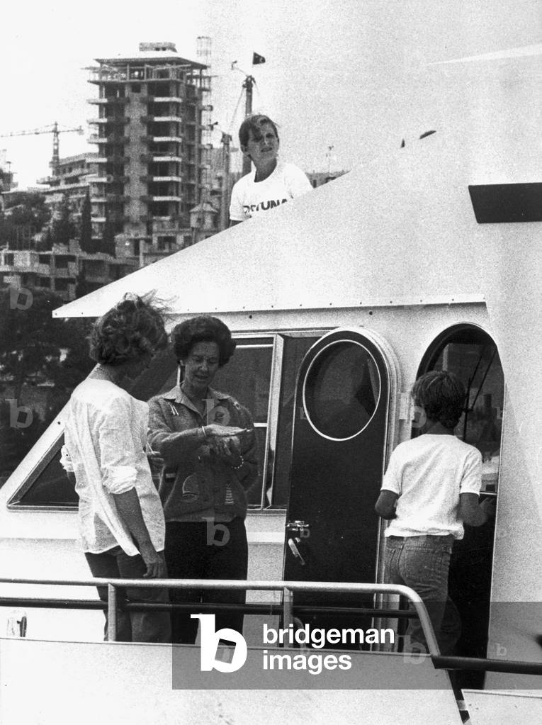 queen Sofia of Spain and Queen Fabiola of Belgium, during holidays at Palma de Majorque, here on the deck of boat Fortuna , August 3, 1977. On r : prince Felipe of Spain, top : Princess Christina of Spain