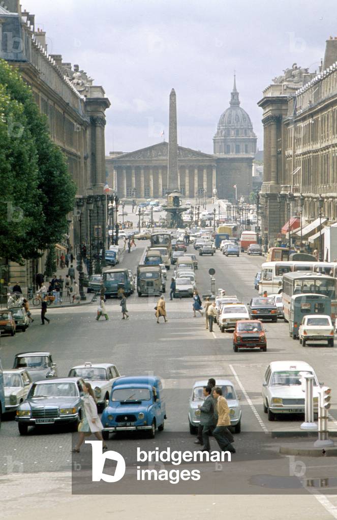 view of the rue Royale in Paris in 1974 , in the background the Concorde square and the Obelisk and the National Assembly (Bourbon palace)