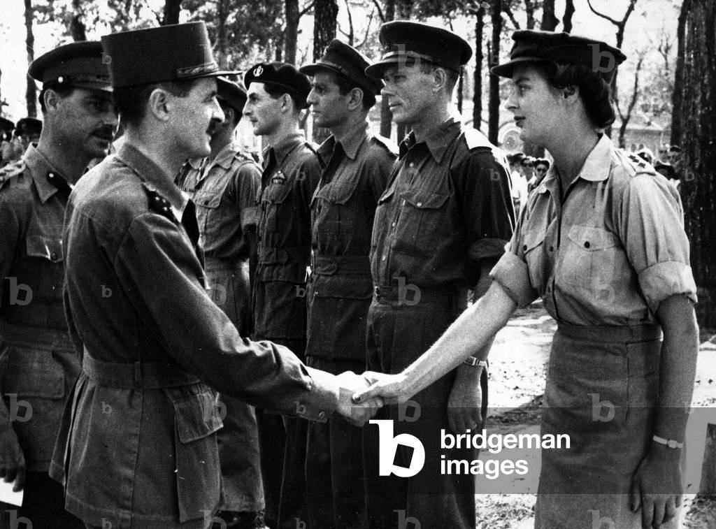 French General Philippe Leclerc de Hauteclocque saluting British officers still in Saignon, Indochina, 1946