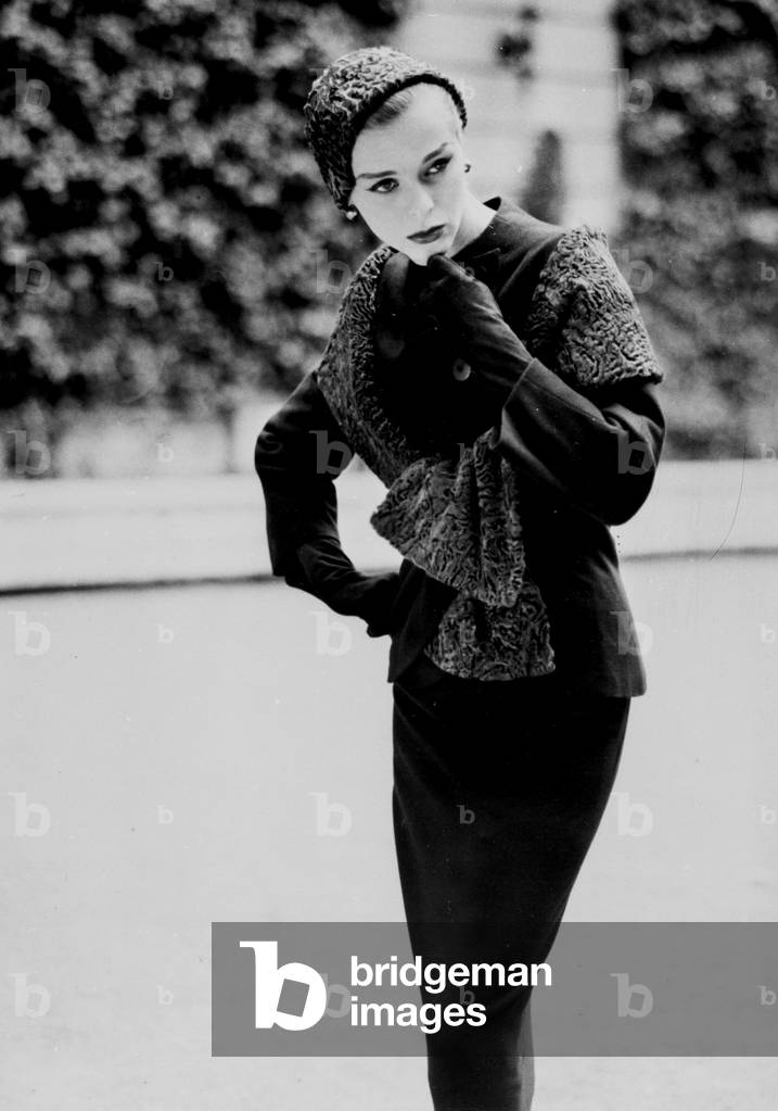 A model of a suit by dress designer Jean Desses, August 21, 1957