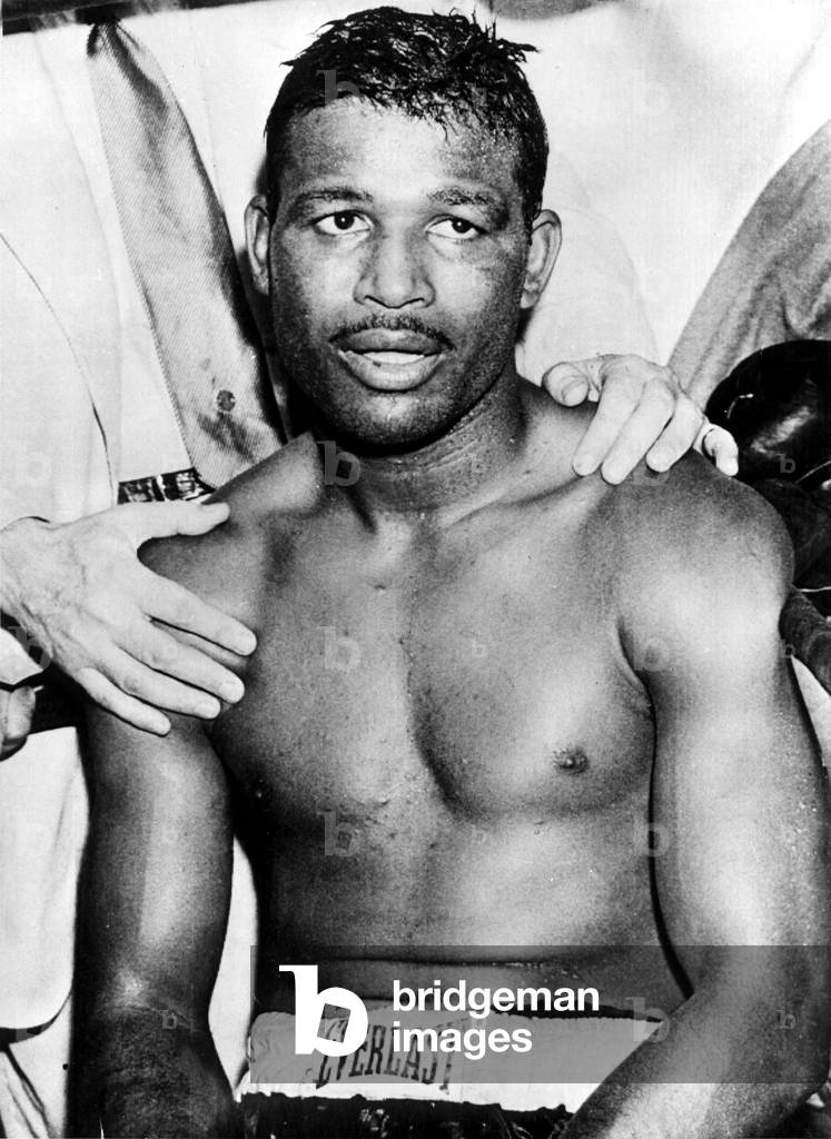 American boxer Sugar Ray Robinson (1921-1989) sits in his corner after TKO victory in 14th round of title bout was awarded to light-heavyweight champ JoeyMaxim June 25, 1952 Yankee Stadium in New York