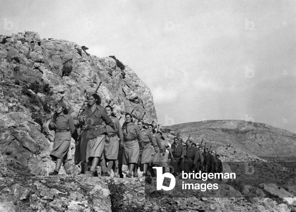 A mixed patrol of men and women passing through the hilly country near Athens. October 19th, 1944.