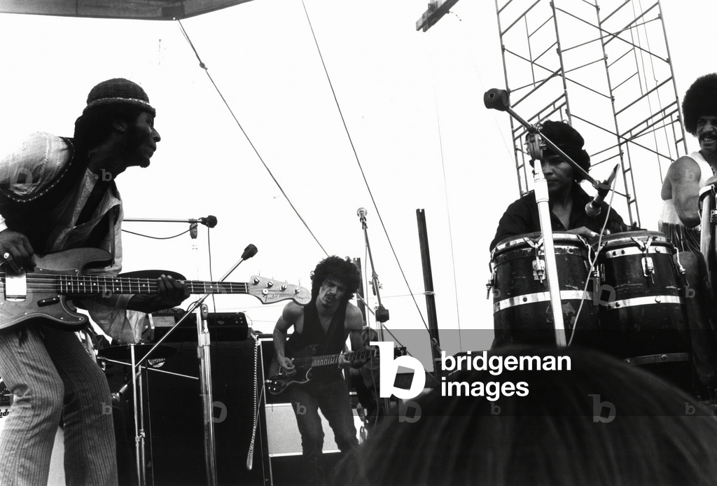 Guitarists David Brown and Carlos Santana during Music and Art Festival in Woodstock, August 1969 (b/w photo)