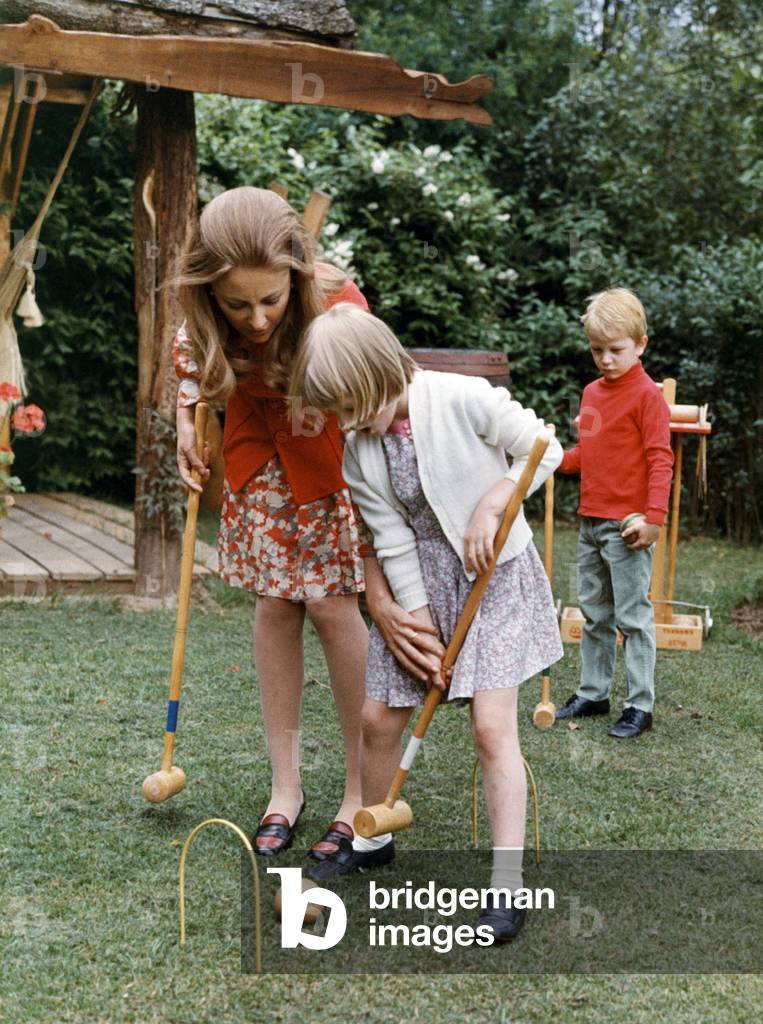 Princess Paola of Belgium with children Astrid and Laurent playing croquet, 1969
