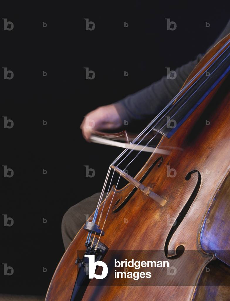 Bild von Fotografie "Cello wird gespielt mit" von Chris Stock