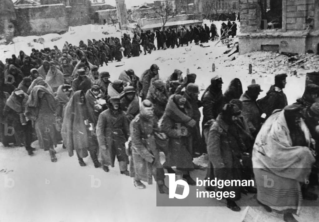 German prisoners march through the snowy streets of battered Stalingrad in Jan.-Feb. 1943. Wrapped in blankets