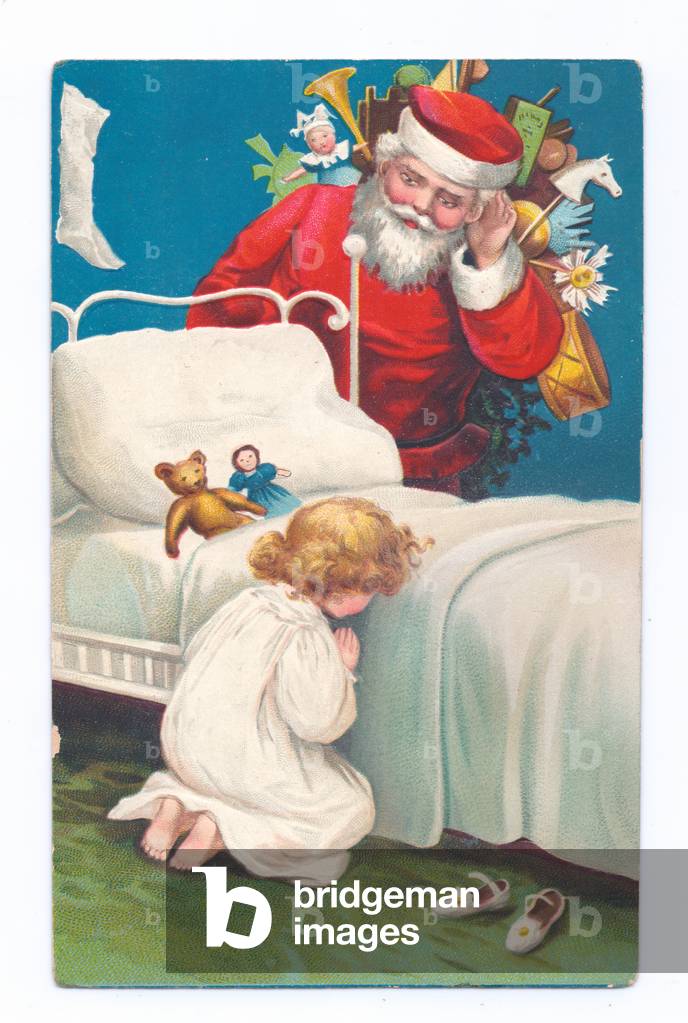 Edwardian postcard of Father Christmas with toys on his back listening to a child praying, c.1910 (colour lith