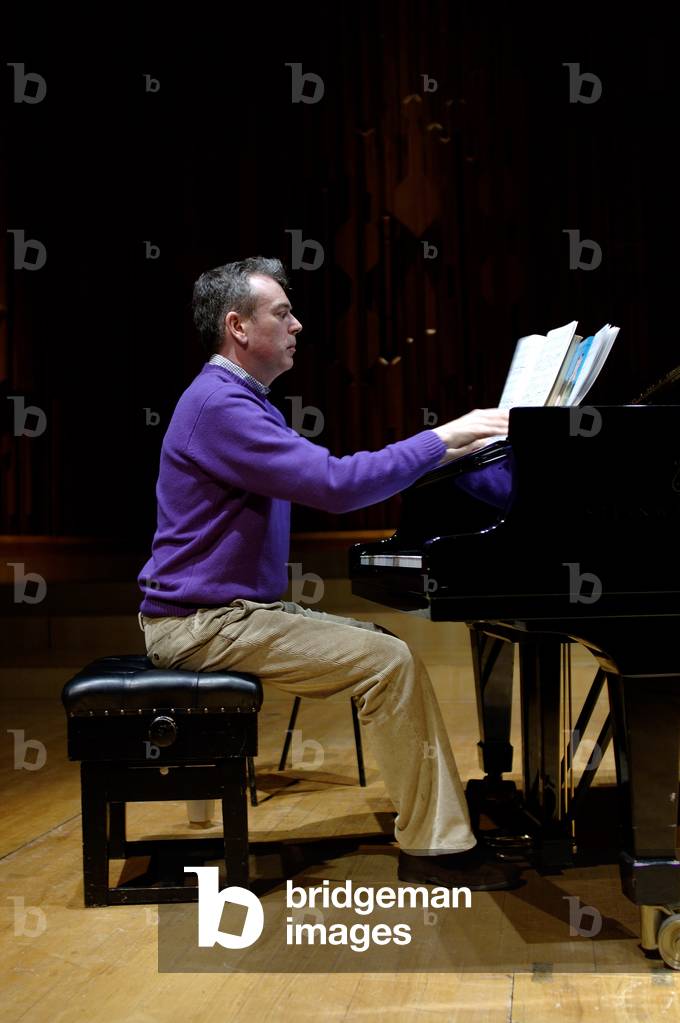 Image of Photography depicting Malcolm Martineau playing piano