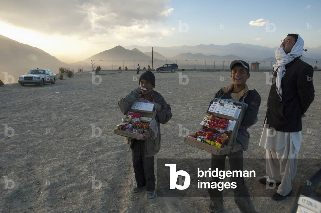Afghan Boys Selling Cigarettes and Candy on the Tapa Maranjan Ridge in Kabul, Afghanistan (photo)