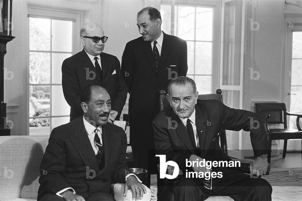 Image of President Lyndon B. Johnson, seated with Anwar Sadat, in the