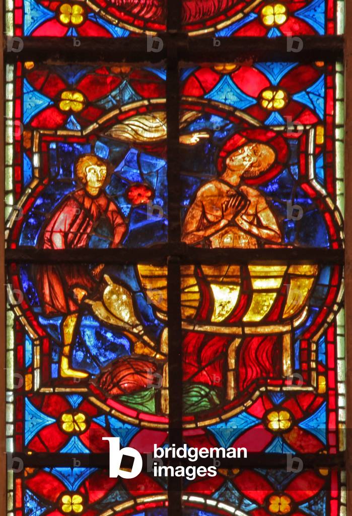 Window w212 depicting a scene from the legend of St John: the saint is plunged into boiling oil (stained glass