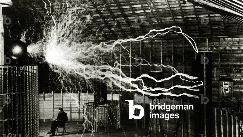 A multiple exposure picture of Tesla with his 'Magnifying transmitter