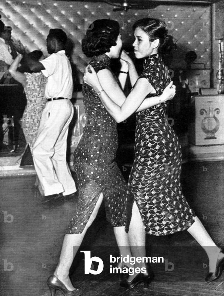 Image of Vietnam Taxi dancers dancing together at the ArcenCiel Club on