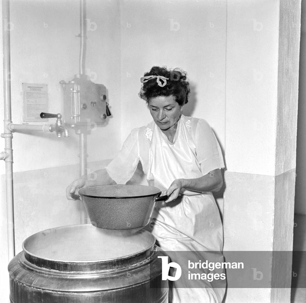 Image of A housewife in a laundry room in Zurich, Switzerland, pictured