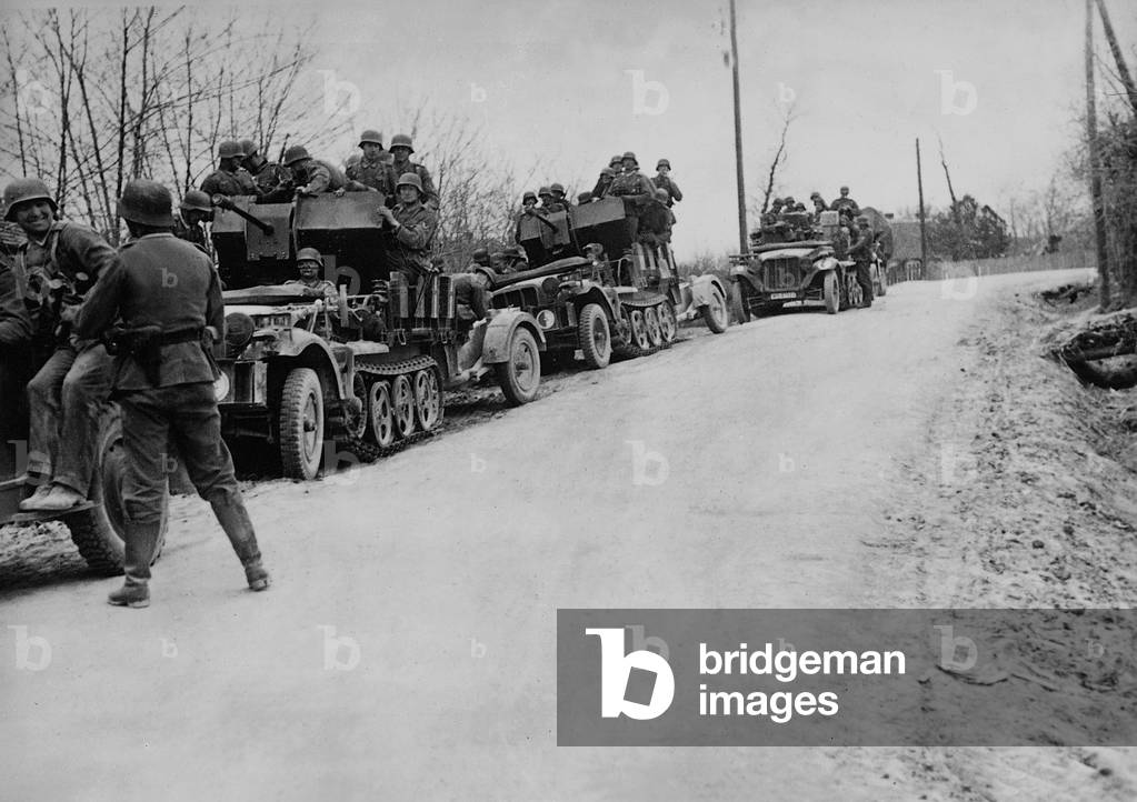 Image of Photography depicting German troops advancing in Yugoslavia 1941, b/w