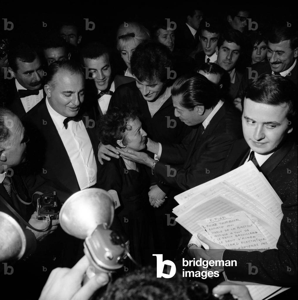 Image of Photography depicting French Singer Edith Piaf congratulated by Bruno Coquatrix 1962 by Giovanni Coru