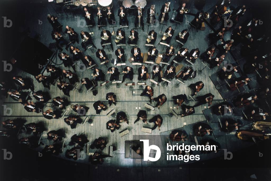 Eugene Ormandy conducting orchestra