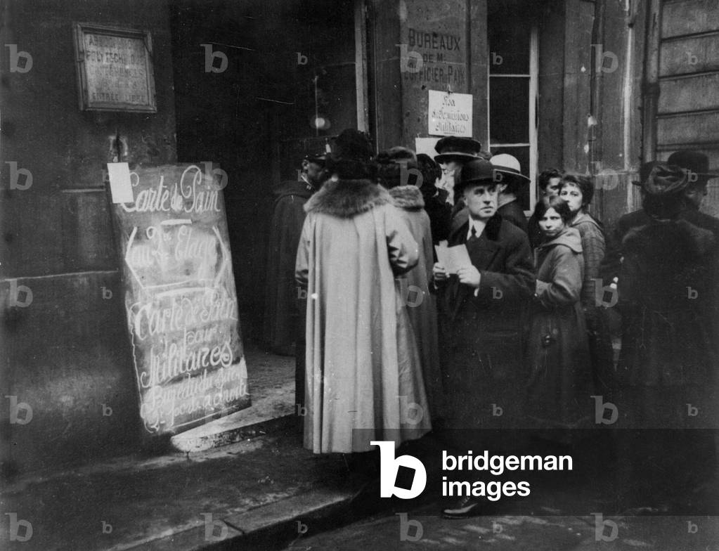 line in front of parisian town hall for the distribution of food cards during the great war, b/w