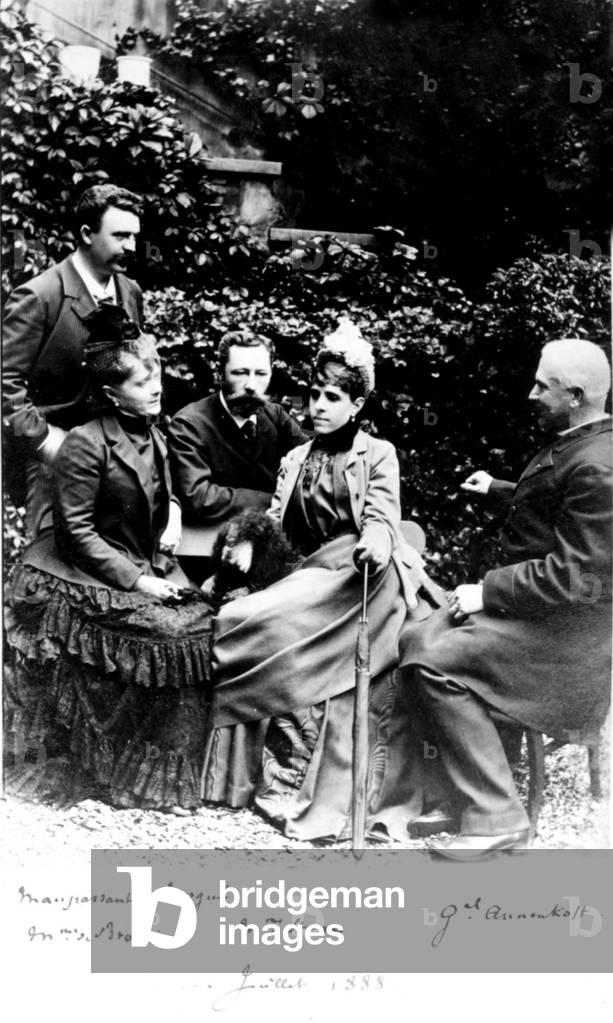 Image of Photography depicting French writer Guy Maupassant (standing) with his friends Mrs Brossia 1888, b/w
