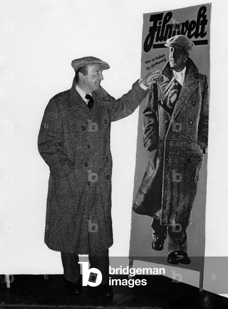 Image of Photography depicting Hans Albers observing an advertising poster 1934