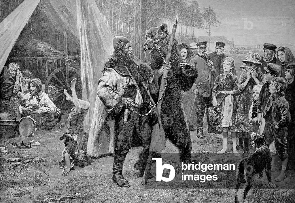 uomo con un addomesticato orso