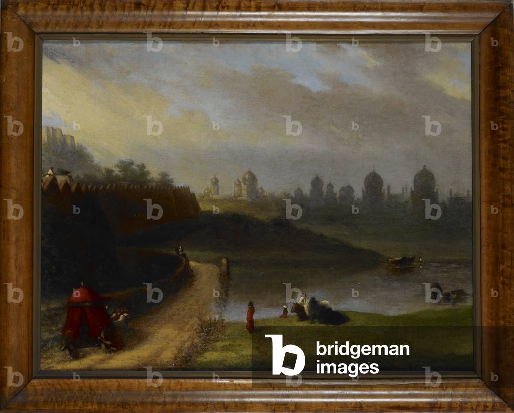 A view of the mausoleums of the Qutb Shahi Kings (1507-1687) outside Golconda. A herds boy in red turban and a