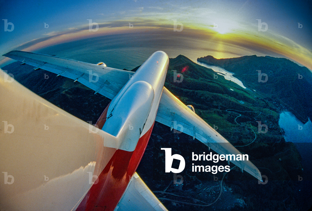 Camera mounted on jet's tail fin captures flight over coastline., 1977 (photo)