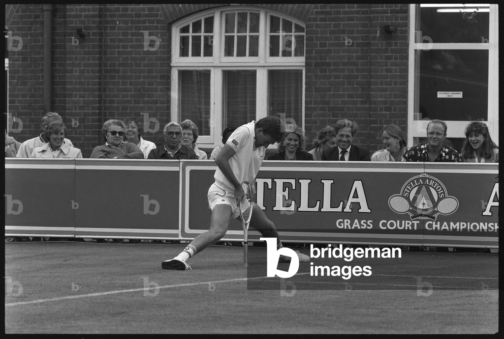 Jimmy Connors Prince Racket Image of JImmy COnnors leans on his racket as he spreads his by Letkey, Roy