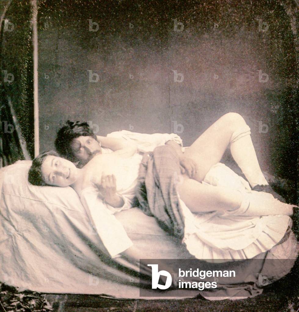 Image of A man and a woman lying on a bed, 1850 by French Photographer,  (19th century)