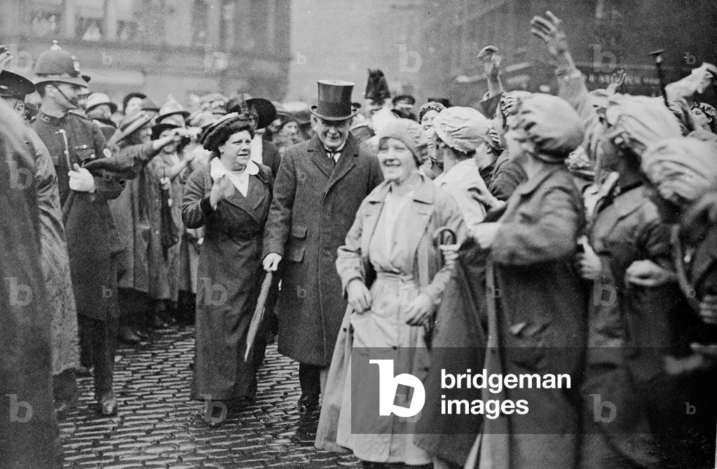 Image of Photography depicting Former member of WSPU Flora Drummond with Lloyd George at a munitions factory i