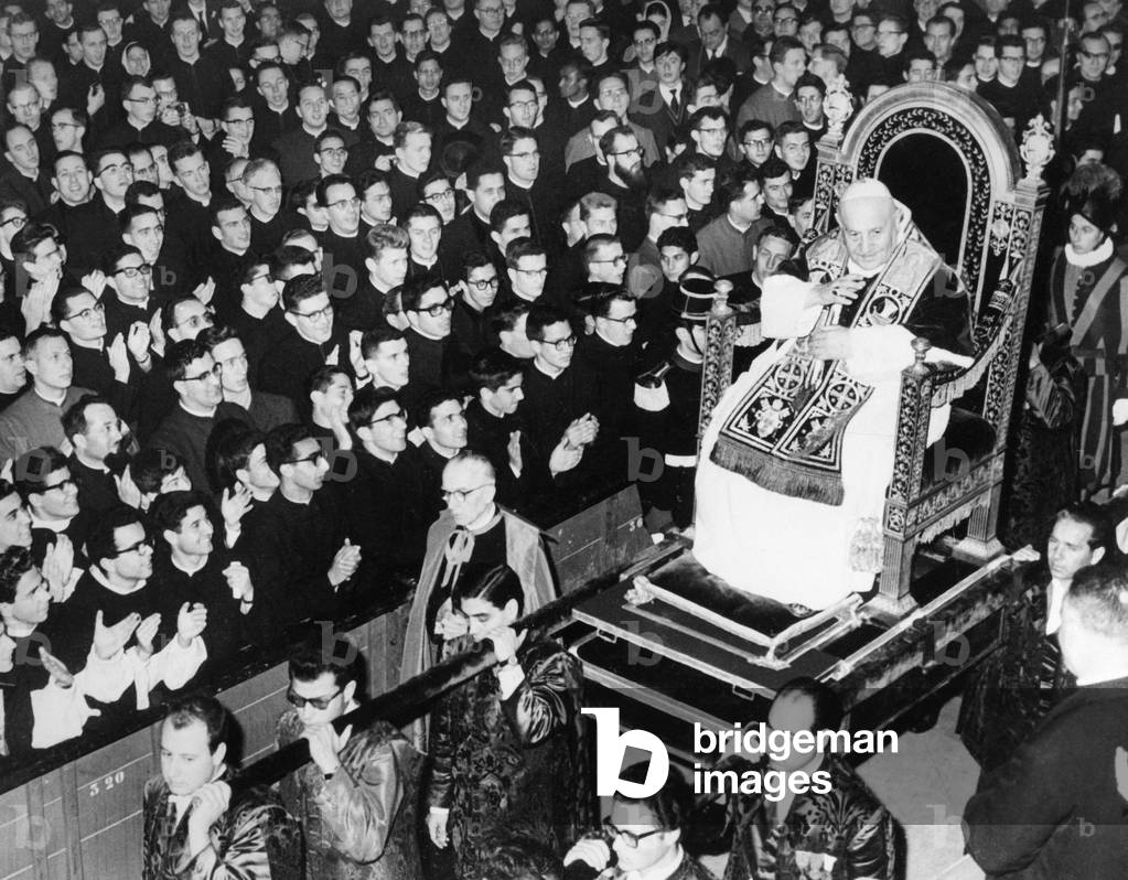 JOHN XXIII (1881-1963) Pope, 1958-1963. Blessing the crowd while being  carried on his throne