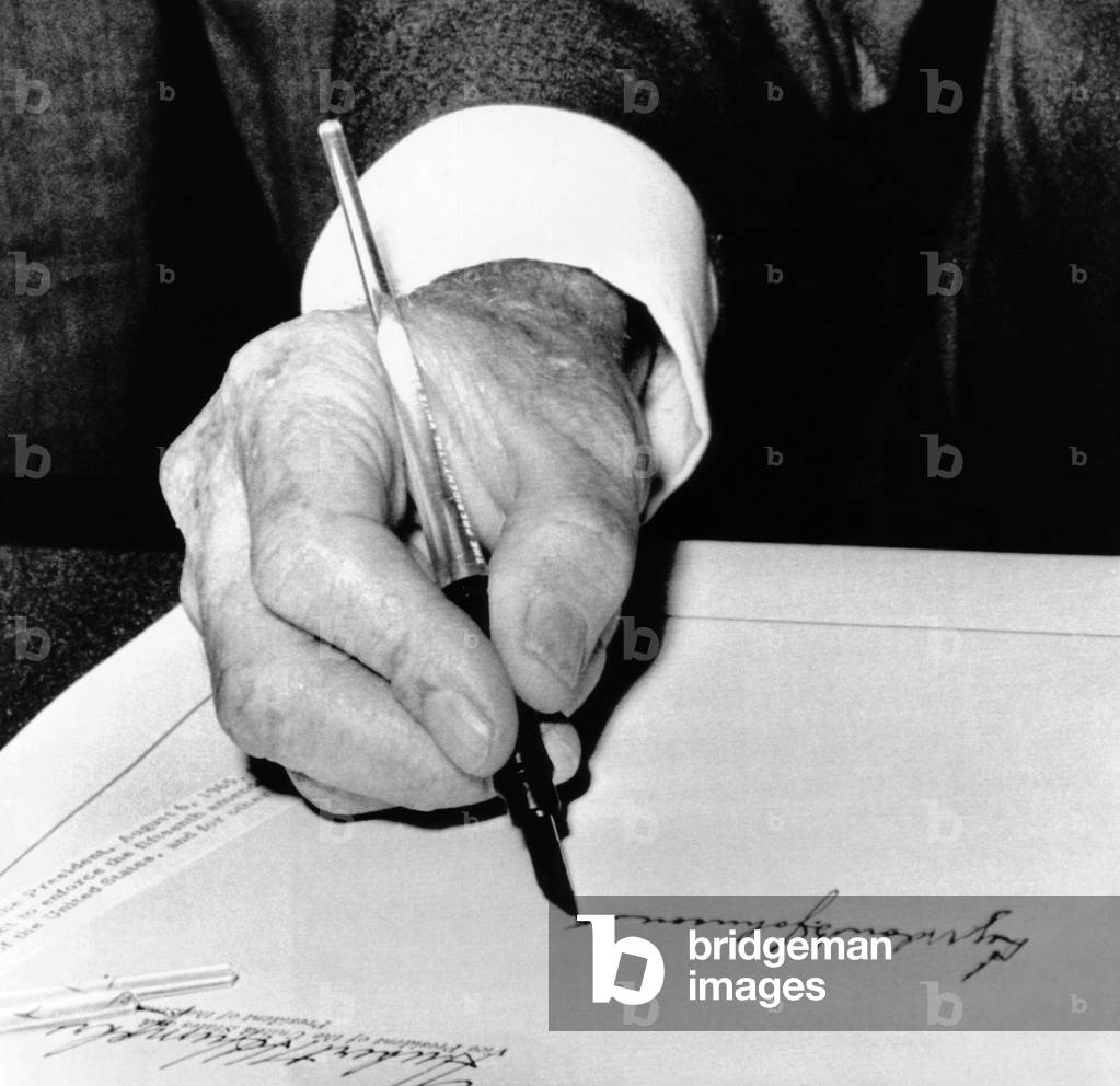 Image of President Lyndon Johnson signing the 1965 Civil Rights Bill, also