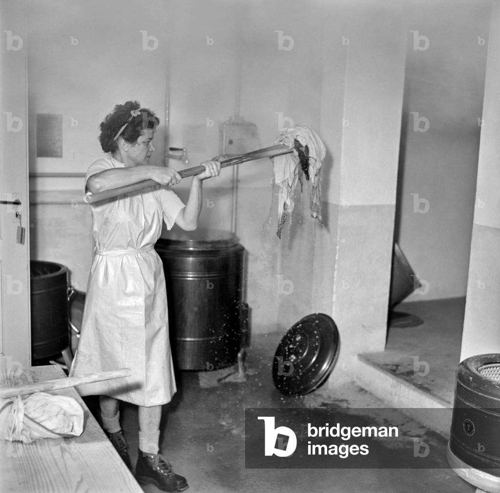 Image of A housewife in a laundry room in Zurich, Switzerland, pictured