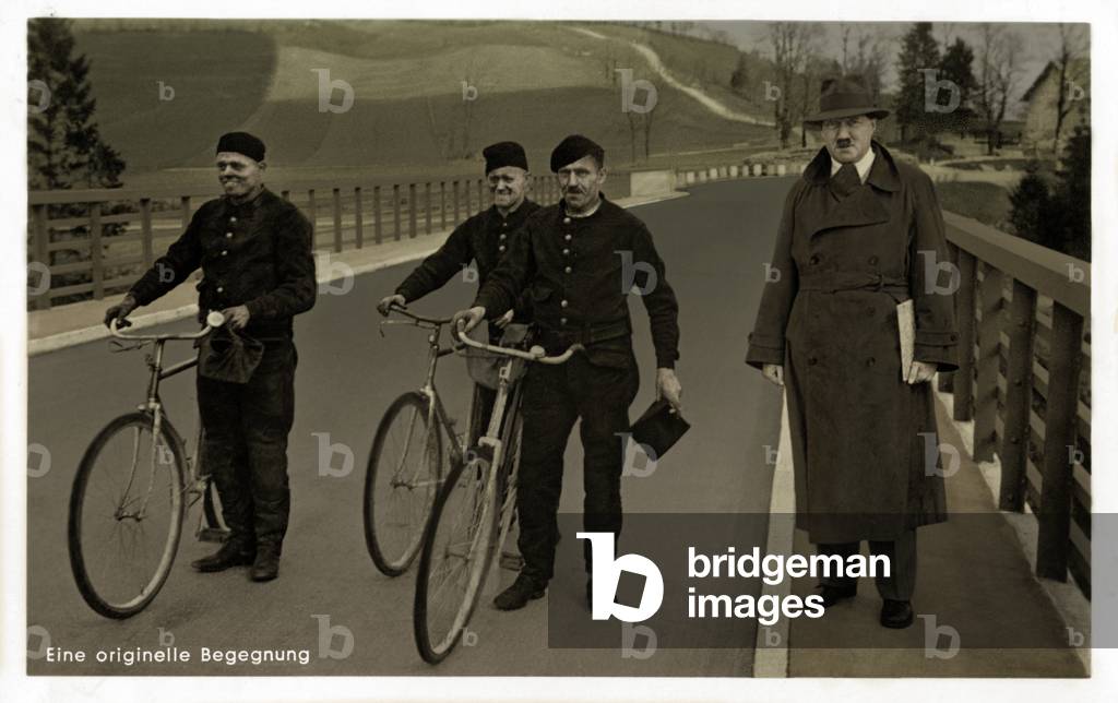 Hitler Riding Bike Image of Adolf Hitler with soldiers on bicycles