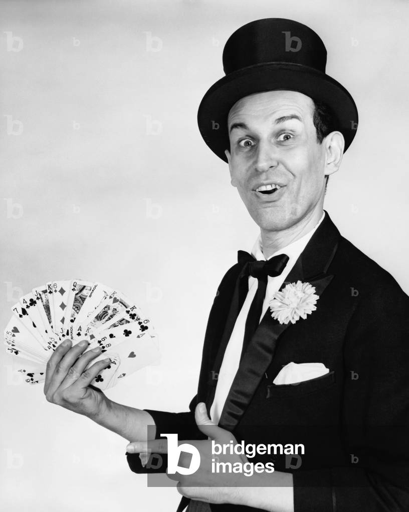 Image of Portrait of a magician performing card tricks