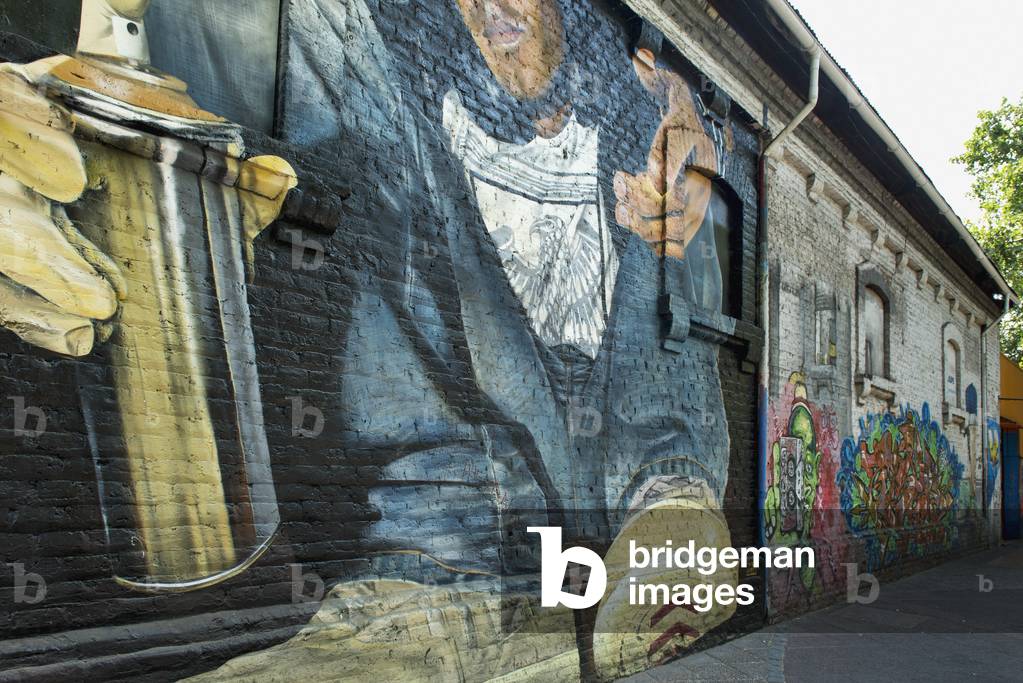 Image of Mural of a graffiti artist with a can of spray