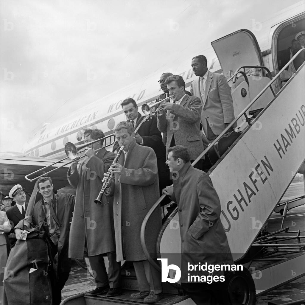 Shortly after leaving the plane the Chris Barber Band is playing music at Hamburg airport, b/w